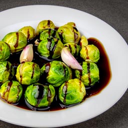 Brussels sprouts roasted to perfection with olive oil, garlic, and balsamic glaze.